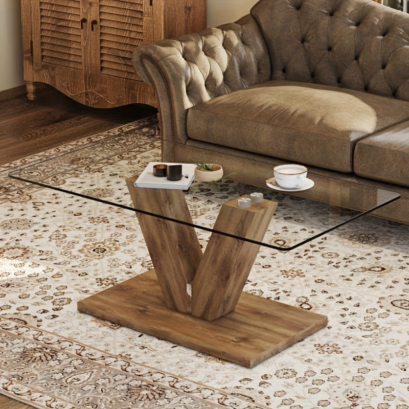 A modern minimalist style coffee table. Transparent tempered glass tabletop with columns. Suitable for living room and dining room